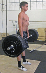 kid doing barbell deadlift